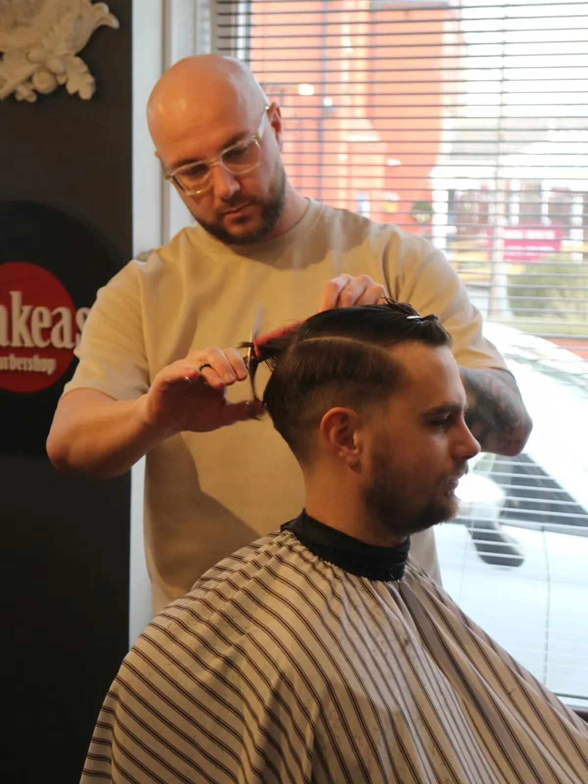 Scissor work mid-cut on a younger client