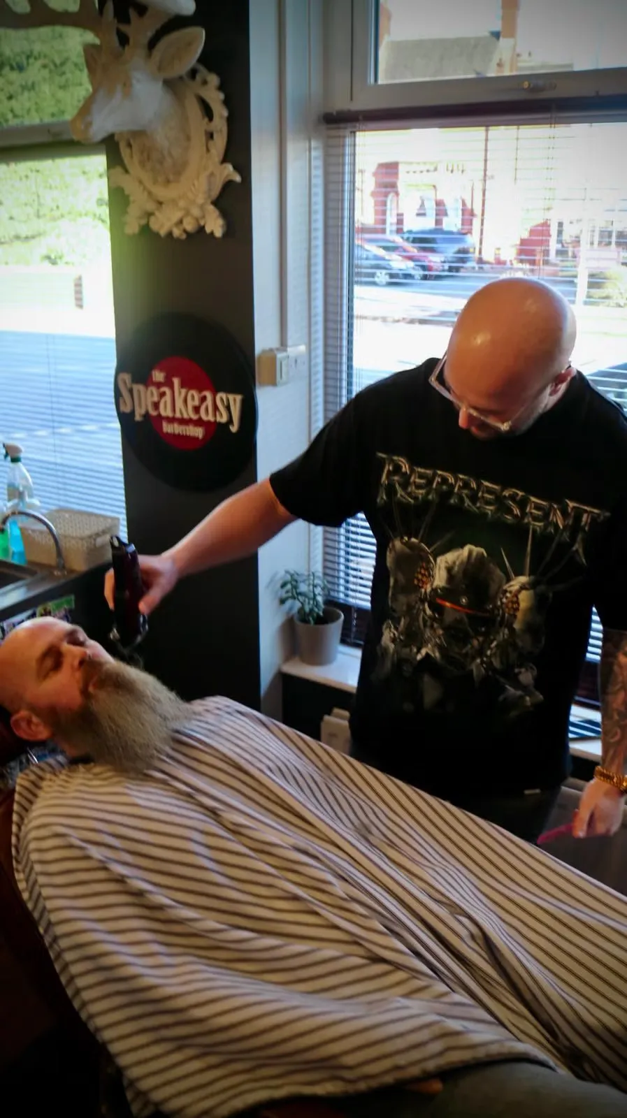 Hot towel straight-razor work on a long beard